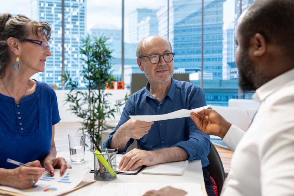broker offering the agreement contract to elderly couple